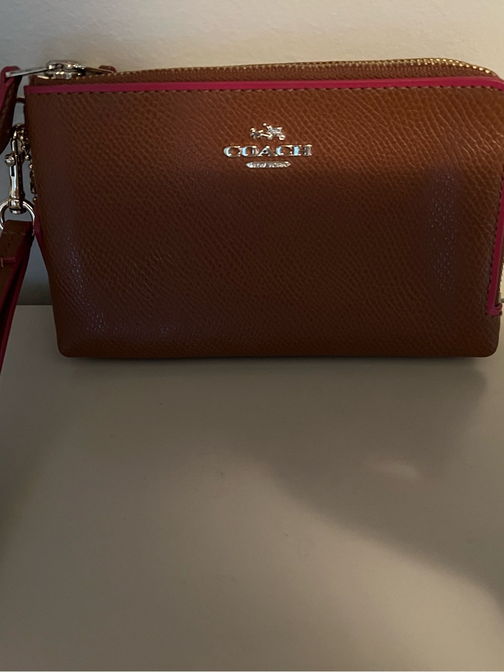 Coach Brown Leather Wristlet with Pink Trim and Silver Logo